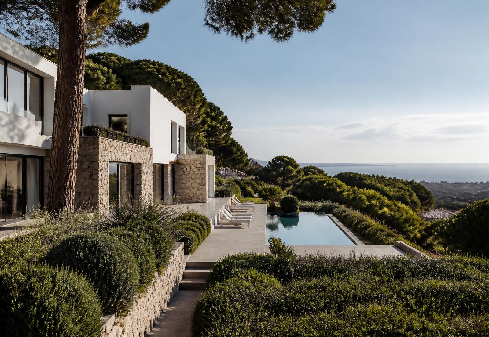 Casa Llavaneres con volúmenes blancos, piedra, piscina y vistas al mar